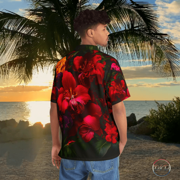 Model wearing a red hibiscus floral pattern hawaiian. Yellow flowers are scattered here and there. The pattern is set against a black background. The setting is a hawaiian beach sunset.