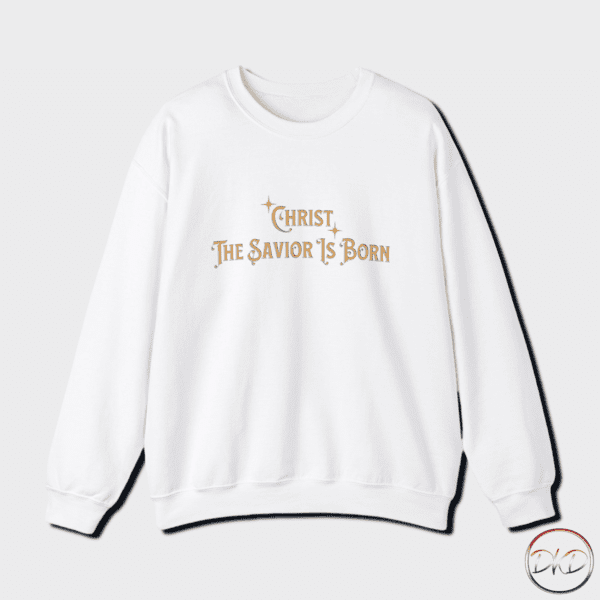 Cozy unisex crewneck Christmas sweatshirt with "Christ The Savior Is Born" text in gold letters, perfect for the colder months. The classic fit and medium-heavy fabric blend provide comfort and durability. Ideal for those looking to celebrate the holiday season with a touch of festive spirit.