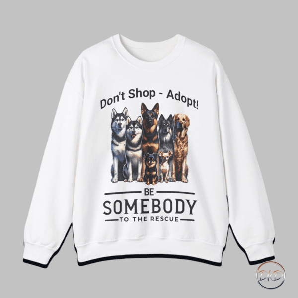 A cozy Unisex Heavy Blend™ Crewneck Sweatshirt featuring Don't Shop - Adopt text above a line-up of dogs with Be Somebody To The Rescue underneath. Designed for supporters of the Somebody To The Rescue non-profit organization or anyone dedicated to rescuing and placing dogs in their forever homes. This sweatshirt gives off a warm and caring vibe, perfect for animal lovers and advocates of pet adoption. Ideal for casual wear during the colder months or as a meaningful gift for pet lovers, especially around holidays like National Dog Day or Adopt a Shelter Pet Day.