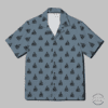 This short-sleeved button-up shirt features a vibrant slate gray background with a repeating pattern of black sailboats, creating a nautical theme. With its casual and summery appearance, this shirt is perfect for leisure or vacation wear. Ideal for men looking for a stylish and comfortable option for beach days, cruises, or summer parties.