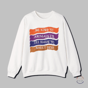 A cozy and durable sweatshirt with a funny grunge design featuring the quote 'Be Kind To Animals Or I'll Have To Shoot You' set against colorful brush strokes. Perfect for those looking for a comfortable and stylish garment to wear during the colder months. This sweatshirt is ideal for adults with a quirky sense of humor, making it a great choice for casual wear or as a gift for animal lovers. Relevant for animal rights activism events or as a unique statement piece during the holiday season.