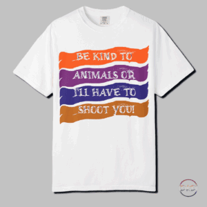A humorous T-shirt with text that reads 'Be kind to animals or I'll have to shoot you' set against colorful brush strokes. This shirt is perfect for animal lovers with a witty sense of humor, adding a playful touch to their wardrobe. The relaxed fit and classic crew neckline make it versatile for both casual and semi-formal settings, ideal for everyday wear or special occasions. Great for animal rights advocates, pet owners, and anyone with a love for animals. Perfect for wearing on casual days, animal-related events, Earth Day, and World Animal Day.