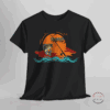 A unisex heavy cotton tee featuring a fishing rod with a fish on the hook set against a minimalist sunset and waves design, with text that says 'hooked'. The tee exudes a relaxed, outdoorsy vibe, perfect for fishing enthusiasts or nature lovers, and those who enjoy outdoor activities, adding a touch of style to their casual wear. Ideal for gifting during Father's Day, Mother's Day, birthdays, or outdoor enthusiast celebrations. The perfect lucky fishing or angling shirt for him or her.