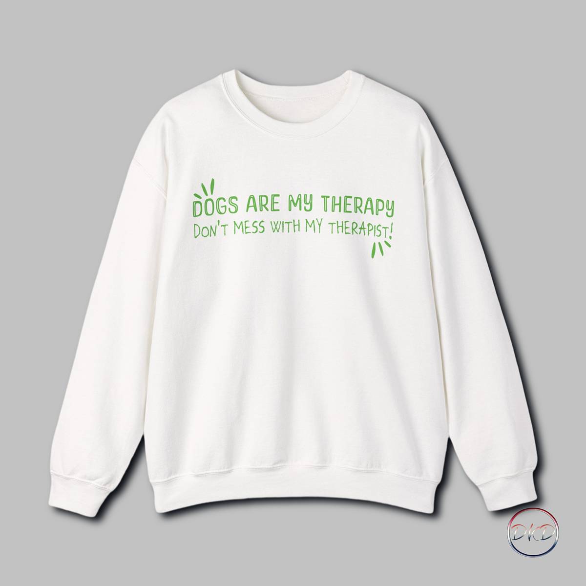 A cozy Gildan sweatshirt featuring a playful text design that reads 'Dogs Are My Therapy - Don't Mess With My Therapist'. This sweatshirt is perfect for dog lovers who find comfort and joy in the presence of their furry friends. It is ideal for casual wear during colder months, providing both warmth and style. Great for dog lovers, pet owners, and anyone who values the therapeutic effects of spending time with their pets. Relevant for holidays like National Dog Day and occasions celebrating the bond between humans and dogs.