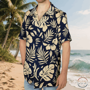 This Hawaiian Button-Down Shirt features cream on navy tropical florals—stylized hibiscus blooms, monstera leaves, palm fronds, and delicate ferns. It exudes a classic island vibe with a soft, elegant twist, perfect for casual settings or beach days. Ideal for those who love tropical themes, this shirt is great for vacations, luaus, summer parties, and beach outings.