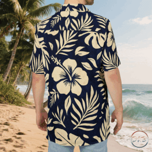 This Hawaiian Button-Down Shirt features cream on navy tropical florals—stylized hibiscus blooms, monstera leaves, palm fronds, and delicate ferns. It exudes a classic island vibe with a soft, elegant twist, perfect for casual settings or beach days. Ideal for those who love tropical themes, this shirt is great for vacations, luaus, summer parties, and beach outings.