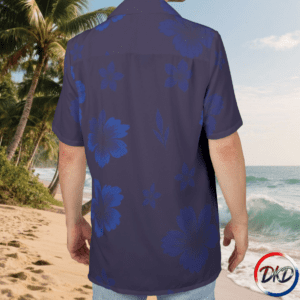 Model wearing shirt back-Elevate your summer style with Blue Ember Bloom, a unisex Hawaiian shirt designed for bold, tropical expression. Featuring oversized blue hibiscus flowers against a deep purple background, this vibrant button‑up delivers standout island energy in a lightweight, breathable fabric. Perfect for vacations, beachwear, resort outfits, and everyday casual looks, this tropical floral shirt brings comfort and color to any warm‑weather wardrobe.