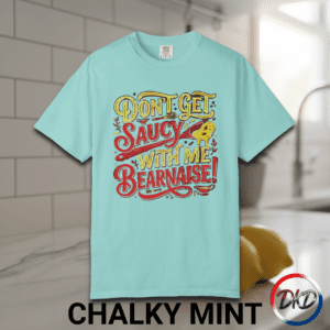 Serve up some attitude with this playful “Don’t Get Saucy With Me Béarnaise!” Comfort Colors® tee — the perfect blend of chef humor, retro diner vibes, and laid‑back everyday style. Printed on the fan‑favorite Comfort Colors® 1717, this shirt delivers that soft‑washed, lived‑in feel people love, available in six classic garment‑dyed colors.