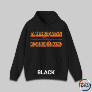 A Black hooded sweatshirt featuring bold retro orange‑and‑brown typography that reads “A Hard Man Is Good to Find,” with a vintage curved accent line and star centered between the text lines.