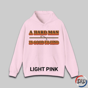 A Light Pink hooded sweatshirt featuring bold retro orange‑and‑brown typography that reads “A Hard Man Is Good to Find,” with a vintage curved accent line and star centered between the text lines.