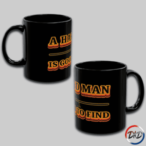 A black ceramic coffee mug, right side and left side featuring bold retro orange‑and‑yellow gradient typography that reads “A Hard Man Is Good to Find,” with a vintage horizontal accent line and small star details.